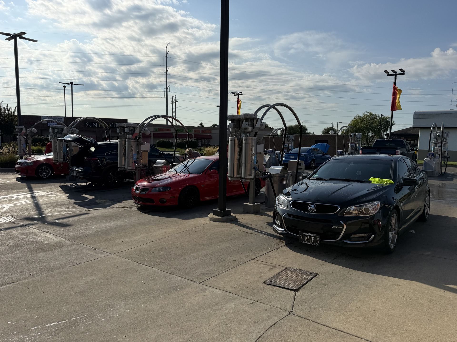 Cars fueling up at a gas station during the drive