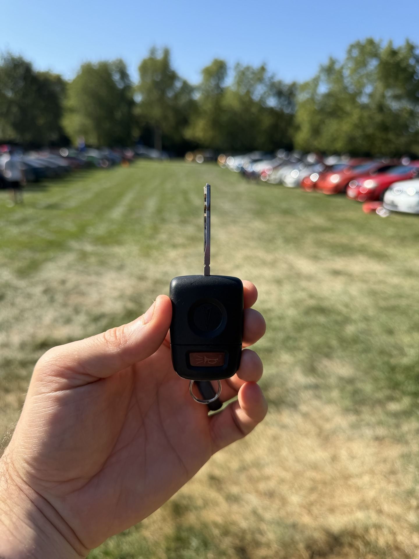 Holding up the SS's key fob on the grass at the show field