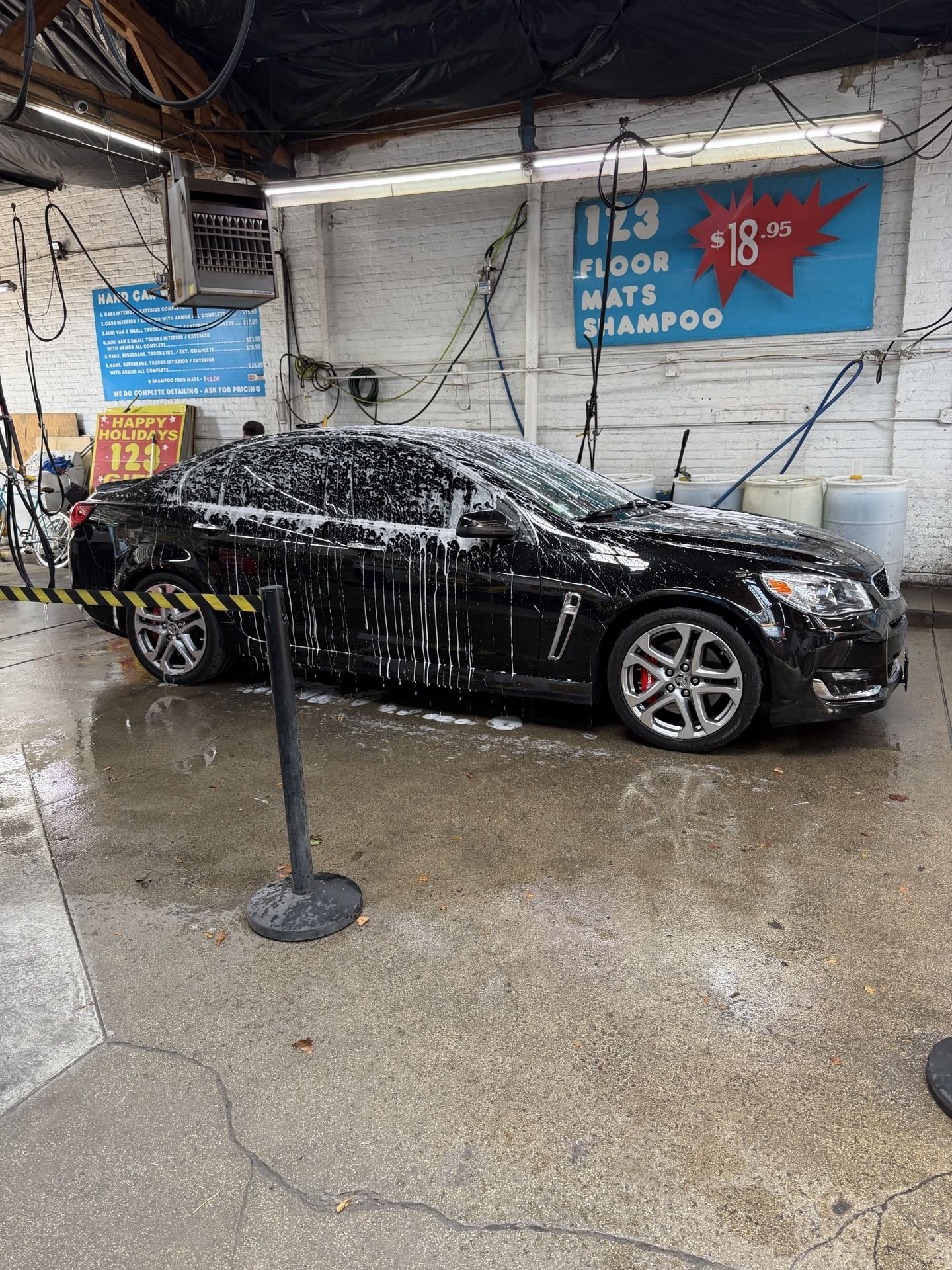 2017 Chevy SS getting washed at a car wash bay